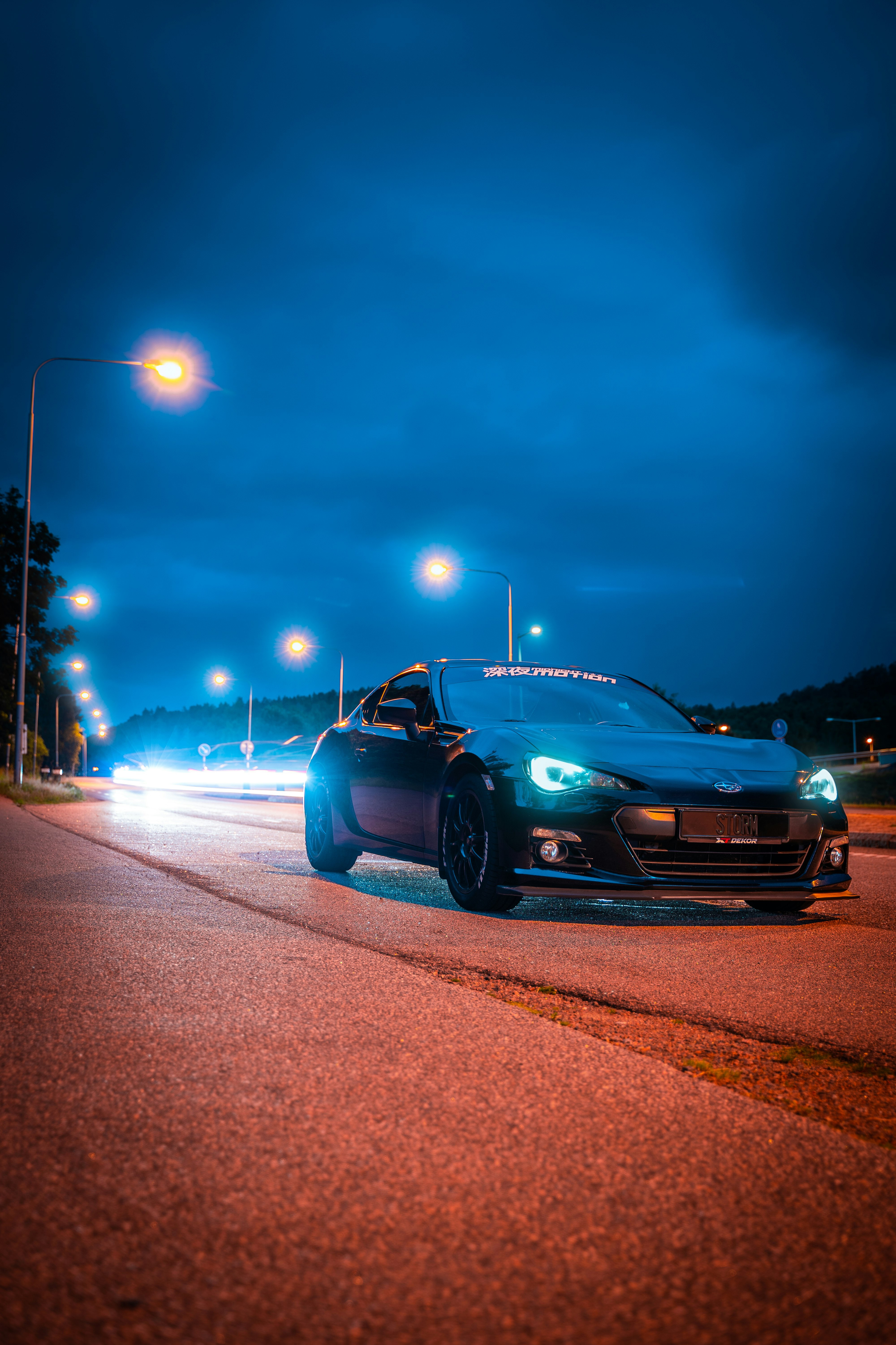 black chevrolet camaro on road during night time